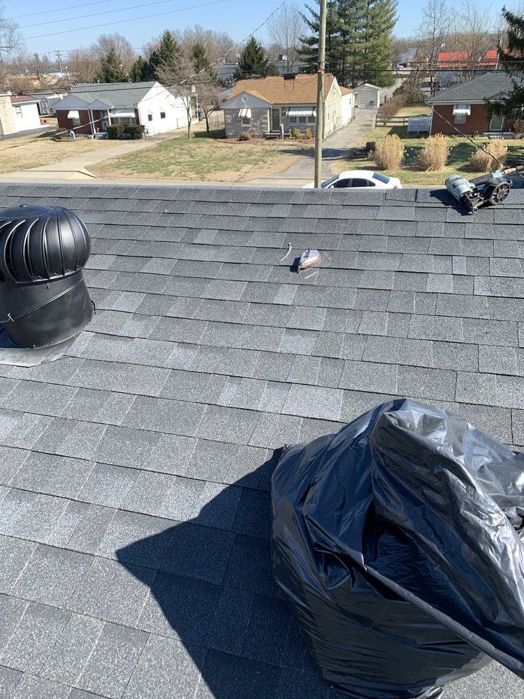 Newly installed dark gray architectural shingles on a Louisville residential roof