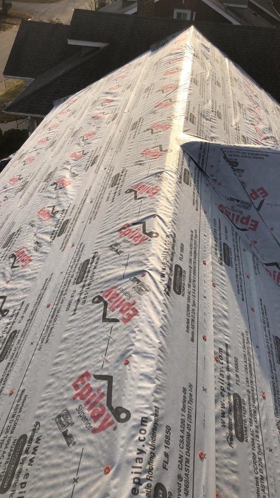 Synthetic underlayment installed across a residential roof deck